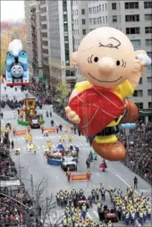  ?? LIAO PAN / FOR CHINA DAILY, SAUL MARTINEZ / REUTERS, HEZI JIANG / CHINA DAILY ?? Clockwise from top left: A Chinese-themed float joins the 90th Macy’s Thanksgivi­ng Day Parade on Thursday in New York City. This year’s display focused on Chengdu, the city known as home of the giant panda. A Charlie Brown float makes its way down 6th...