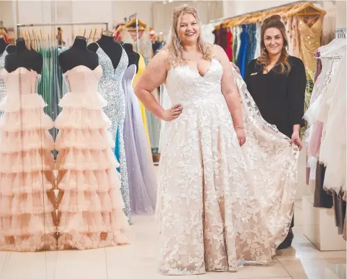  ?? ?? Confetti owner Emily Anderson, right, makes sure Steph Jay is dressed in impress in a Confetti Luxe wedding dress, Picture: Chris Kidd