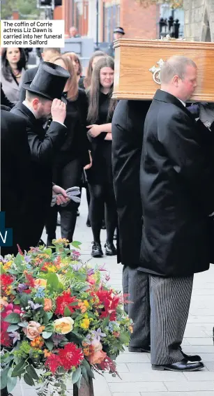  ??  ?? The coffin of Corrie actress Liz Dawn is carried into her funeral service in Salford