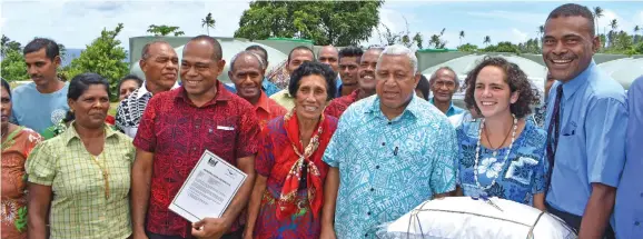  ?? Photo: Wati Talebula ?? Prime Minister Voreqe Bainimaram­a with the water tank recipients at Navakawau Village on January 24, 2018.