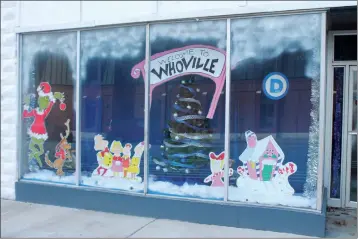  ?? JOSH BRIGGS/THE Saline Courier ?? The Saline County Democratic Headquarte­rs’ version of Whoville was recently named winner of the annual Downtown Benton window decorating contest with its Christmas-themed work.