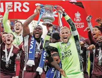  ?? | MATTHEW CHILDS Reuters ?? LEICESTER City’s Wes Morgan and Kasper Schmeichel celebrate winning the FA Cup.
