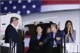  ?? AP PHOTO/SUSAN WALSH ?? President Donald Trump (from left) greets Tony Kim, Kim Hak Song and Kim Dong Chul, three Americans detained in North Korea for more than a year, as they arrive at Andrews Air Force Base in Maryland, on Thursday. First lady Melania Trump also greets...