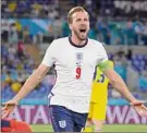  ?? Alberto Lingria / Getty Images ?? England's Harry Kane celebrates after scoring the first of his two goals during the quarterfin­als vs. Ukraine on Saturday in Rome.