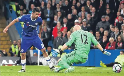  ?? Picture: Getty Images. ?? Diego Costa of Chelsea scores his side’s first goal past Brad Guzan.