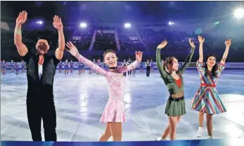  ?? KIM KYUNG-HOON ?? Figure skating pairs gold medalists Zhang Hao and Yu Xiaoyu of China, ladies gold medalist Choi Dabin of South Korea and Ice Dance’s silver medalist Kana Muramoto of Japan (left to right) greet spectators in an exhibition during the closing ceremony of...