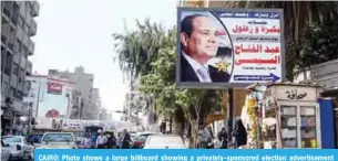  ??  ?? CAIRO: Photo shows a large billboard showing a privately-sponsored election advertisem­ent supporting Egyptian President Abdel Fattah Al-Sisi in Cairo’s northern suburb of Shubra. — AFP