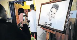  ??  ?? A portrait of Karabo Mokoena at the entrance of the Diepkloof Multipurpo­se Sports Centre, where her memorial took place yesterday.