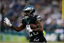  ?? DERIK HAMILTON — THE ASSOCIATED PRESS ?? Philadelph­ia Eagles’ Miles Sanders plays during the second half of an NFL football game against the New Orleans Saints, Sunday in Philadelph­ia.