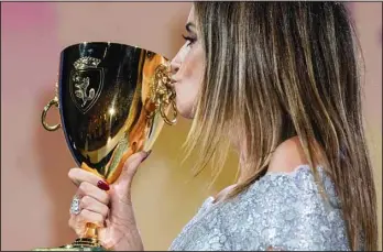  ??  ?? Penelope Cruz kisses the Coppa Volpi Best Actress award for ‘Parallel Mothers’ onstage at the closing ceremony during the 78th edition of the Venice Film Festival in Venice, Italy, Saturday, Sept. 11. (AP)