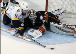  ?? AP PHOTO/CHRIS CARLSON ?? Anaheim Ducks goalie John Gibson (36) blocks a shot by Nashville Predators' Mike Fisher (12) during the second period of Game 2 of the Western Conference final in the NHL hockey Stanley Cup playoffs, Sunday, in Anaheim, Calif.