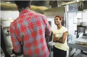  ?? Russell Yip / The Chronicle ?? Malaysian chef Azalina Eusope (right) keeps an eye on trainee Karthick Veeraiyan as he prepares one of her noodle recipes.