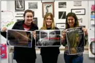  ?? All photos courtesy of Candance Maggioncal­da/PWHS ?? Displaying their winning posters are, from left, Plymouth Whitemarsh High School students Hannay Young, Olivia Gaber and Alexis Elliott.