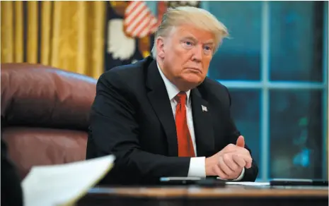  ?? AP PHOTO ?? U.S. President Donald Trump listens to a question during an interview with The Associated Press in the Oval Office of the White House on Tuesday in Washington.