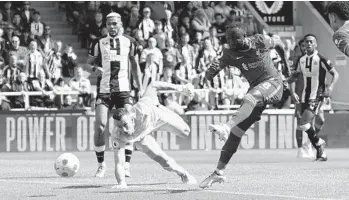  ?? JON SUPER AP ?? Liverpool’s Naby Keita (8) scores his side’s only goal during an EPL match against Newcastle United.