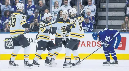 ?? STEVE RUSSELL TORONTO STAR ?? Leafs defenceman Nikita Zaitsev reacts after the Bruins’ second goal by Brad Marchand, second from left, in Game 4 of their first-round playoff series.