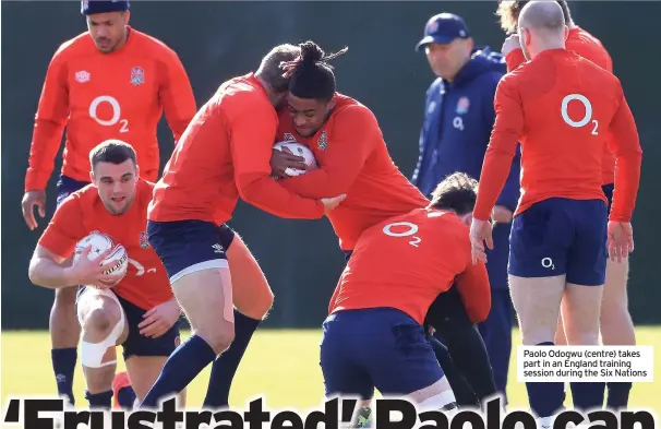  ??  ?? Paolo Odogwu (centre) takes part in an England training session during the Six Nations