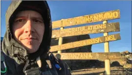  ?? COURTESY OF JEFF BELANGER ?? Jeff Belanger takes a selfie at Stella Point, which is the volcanic rim of Mt. Kilimanjar­o. It’s the last stop before the summit.