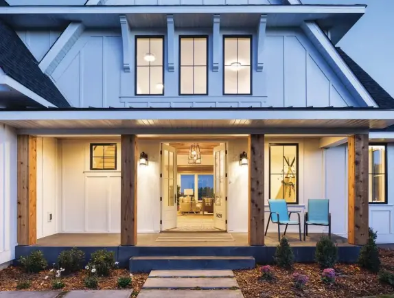  ??  ?? (top) Cedar pillars, which are natural and unpainted, are a striking feature of the front porch.