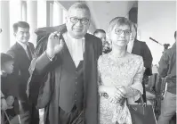  ?? — Gambar Bernama ?? DITERIMA MASUK: Abdul Gani dan isteri Puan Sri Maimon Arif Patail ketika keluar dari perkaranga­n mahkamah selepas majlis penerimaan masuk peguambela dan peguamcara di Kompleks Mahkamah Jalan Duta, Kuala Lumpur semalam.