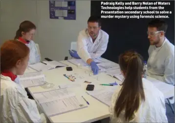  ??  ?? Padraig Kelly and Barry Nolan of Waters Technologi­es help students from the Presentati­on secondary school to solve a murder mystery using forensic science.