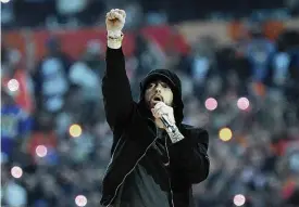  ?? AP PHOTO/TED S. WARREN, FILE ?? Eminem performs during halftime of the NFL Super Bowl 56 football game between the Los Angeles Rams and the Cincinnati Bengals on Feb. 13 in Inglewood, California. The rapper has been inducted into the Rock & Roll Hall of Fame.