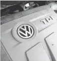 ?? JULIAN STRATENSCH­ULTE, EPA ?? The Volkswagen Touran has a 2.0l TDI type diesel engine. A settlement is near over rigged emissions in more than half a million diesel vehicles.