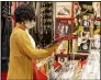  ?? LEONARD ORTIZ, ORANGE COUNTY REGISTER/SCNG ?? Xochitl Munoz, 24, shops for music at Black Hole Records on Feb. 17.