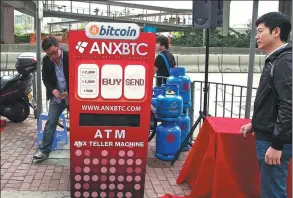  ?? GETTY IMAGES ?? Executives of Asia Nexgen, a Hong Kong-based bitcoin exchange, set up a bitcoin “ATM” in Hong Kong, in 2014. Nexgen had launched the kiosk to enable customers to buy bitcoins and store them in their digital wallets.