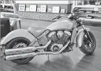 ??  ?? The dealership’s first 2015 Indian Scout is on display. The Scout is designed to compete against the Harley-Davidson Sportster.