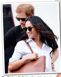  ??  ?? The Husband’s first outing: Meghan in the shirt with Harry in Toronto last year