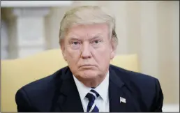  ?? OLIVIER DOULIERY/ABACA PRESS ?? President Donald Trump looks on during a meeting in the Oval Office on April 3 in Washington, D.C.