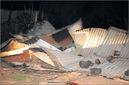  ?? PHOTO: THULANI MBELE ?? SHATTERED: The remains of a shack that belonged to a traditiona­l healer who was set alight by a mob of community members in Khutsong on the West Rand yesterday