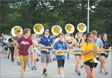  ?? Leslie Hutchison / Hearst Connecticu­t Media file photo ?? Members of the Torrington High School marching band take part in preseason practice in August. They will be part of the school’s ensemble, which will perform at the All-State Conference in April.