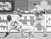  ?? BENNY SIEU/USA TODAY SPORTS ?? The Diamondbac­ks’ Cliff Pennington forces out the Brewers’ Carlos Gomez Saturday.