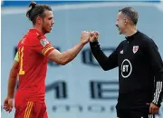  ??  ?? BALE BOND: Giggs congratula­tes his skipper