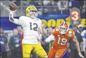  ?? Jeffrey McWhorter The Associated Press ?? Clemson safety Tanner Muse zeros in on Notre Dame quarterbac­k Ian Book in the 2018 Cotton Bowl national semifinal game.