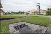  ?? ALAN DIAZ — THE ASSOCIATED PRESS ?? This Tuesday, Sept. 26, 2017 photo shows a catch basin for water in Sweetwater, Fla. The Miami suburb was flooded in 1999 by a hurricane and again in 2000 by more storms - they received $2 million from FEMA for debris removal and repairs to public...