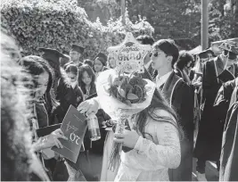  ?? JIM WILSON NYT ?? Graduates gather before a graduation ceremony Saturday at the University of California, Berkeley, in Berkley, Calif.