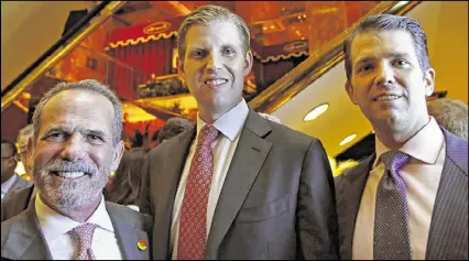  ?? KATHY WILLENS / ASSOCIATED PRESS ?? CEO of Trump Hotels Eric Danziger (from left) joins Eric Trump and Donald Trump Jr., both of whom are executive vice presidents of The Trump Organizati­on at an event in New York on Monday. Danziger has expressed confidence that his company can avoid...