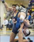  ?? Marc Billett/Tri-State Sports ?? Kiski Area’s Jack Blumer flips Cole Spencer of Pine-Richland in the 152-pound division of the WPIAL Class 3A championsh­ips.