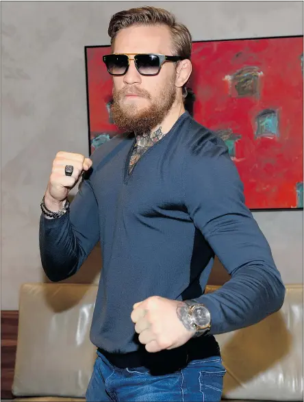  ?? — GETTY IMAGES FILES ?? Conor McGregor strikes a pose at an in-store event at Las Vegas on Monday.