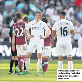  ??  ?? > Swansea were left deflated by their flat display in defeat at West Ham