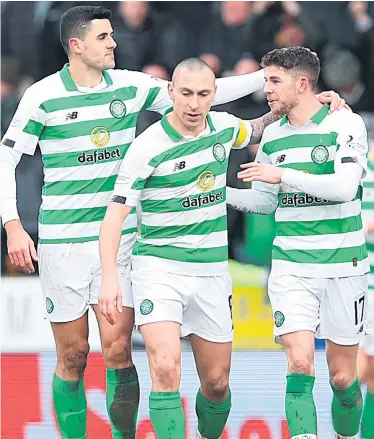  ??  ?? Decisive strike: Ryan Christie (right) is congratula­ted by Tom Rogic and Scott Brown after his goal