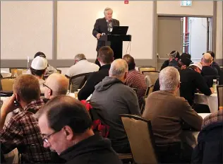  ?? Herald photo by Tim Kalinowski ?? Federal crop scientist Dale Tomasiewic­z speaks during Tuesday's agronomic management session as about 400 farmers and others involved in the agricultur­e industry attended the Alberta government-sponsored 2020 Irrigate Crop Production Update at the Sandman Signature hotel on Tuesday.