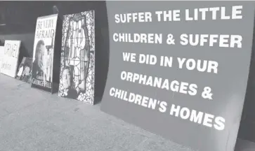  ?? GETTY IMAGES ?? Posters condemn child sex abuse, especially in churches, in Australia.