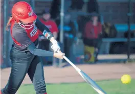  ?? KYLE TELECHAN/POST-TRIBUNE ?? Kankakee Valley’s Mary Kate Shultz makes contact with a pitch during a game at Munster on Monday.