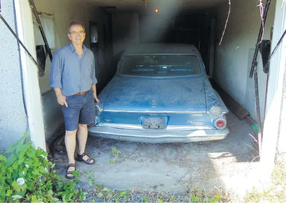  ?? PHOTOS: ALYN EDWARDS ?? Sun columnist Douglas Todd displays the car his grandfathe­r purchased new, now unearthed after more than 40 years of collecting dust in a west-side garage.