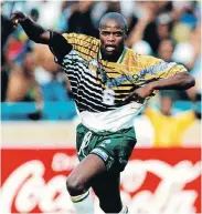  ??  ?? PEOPLE’S HERO: Phil Masinga celebrates scoring the goal in the game against Congo, which booked the country a place in the 1998 Soccer World Cup in France