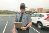  ?? STEVEN HENSHAW/READING EAGLE ?? State Police spokesman Trooper David Beohm addresses the media in Morgantown on Monday morning after the capture of nine escapees.